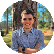 Conner in front of a tree